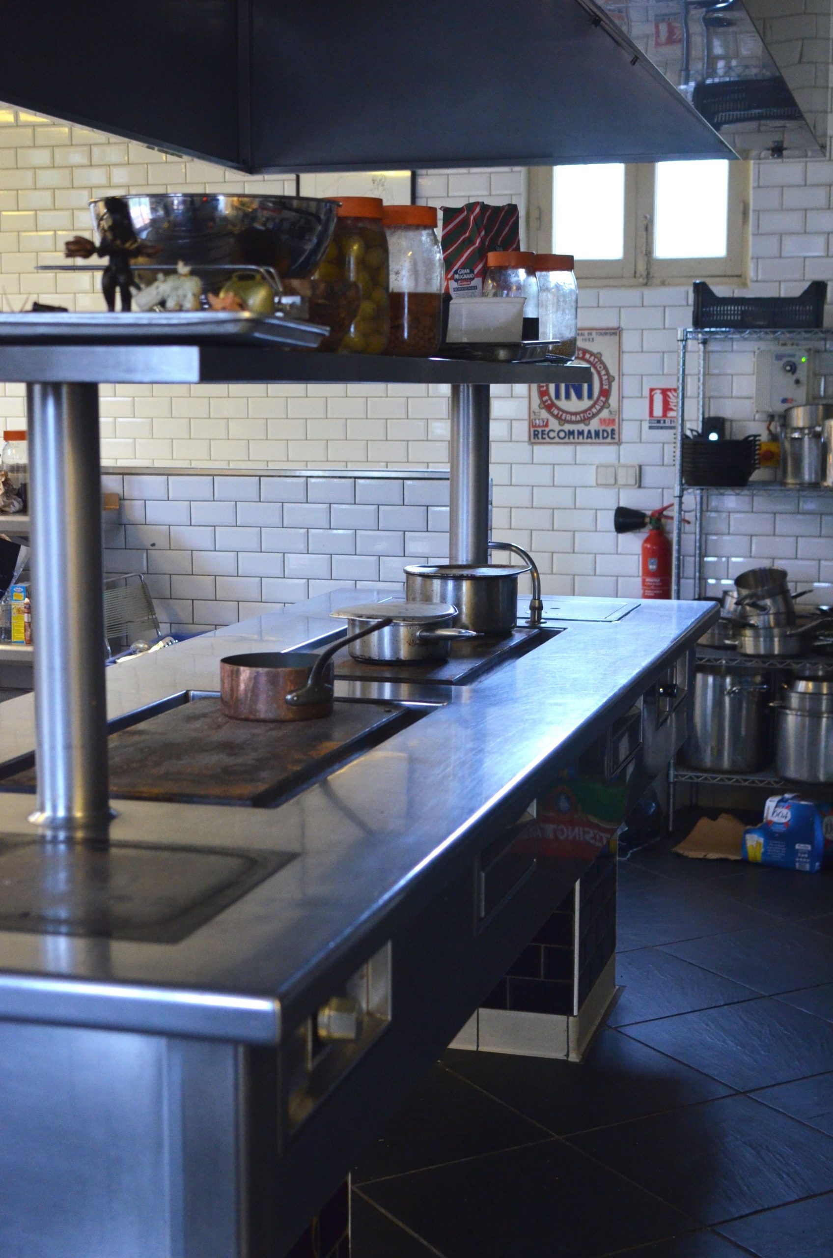 Instructor servicing kitchen equipment