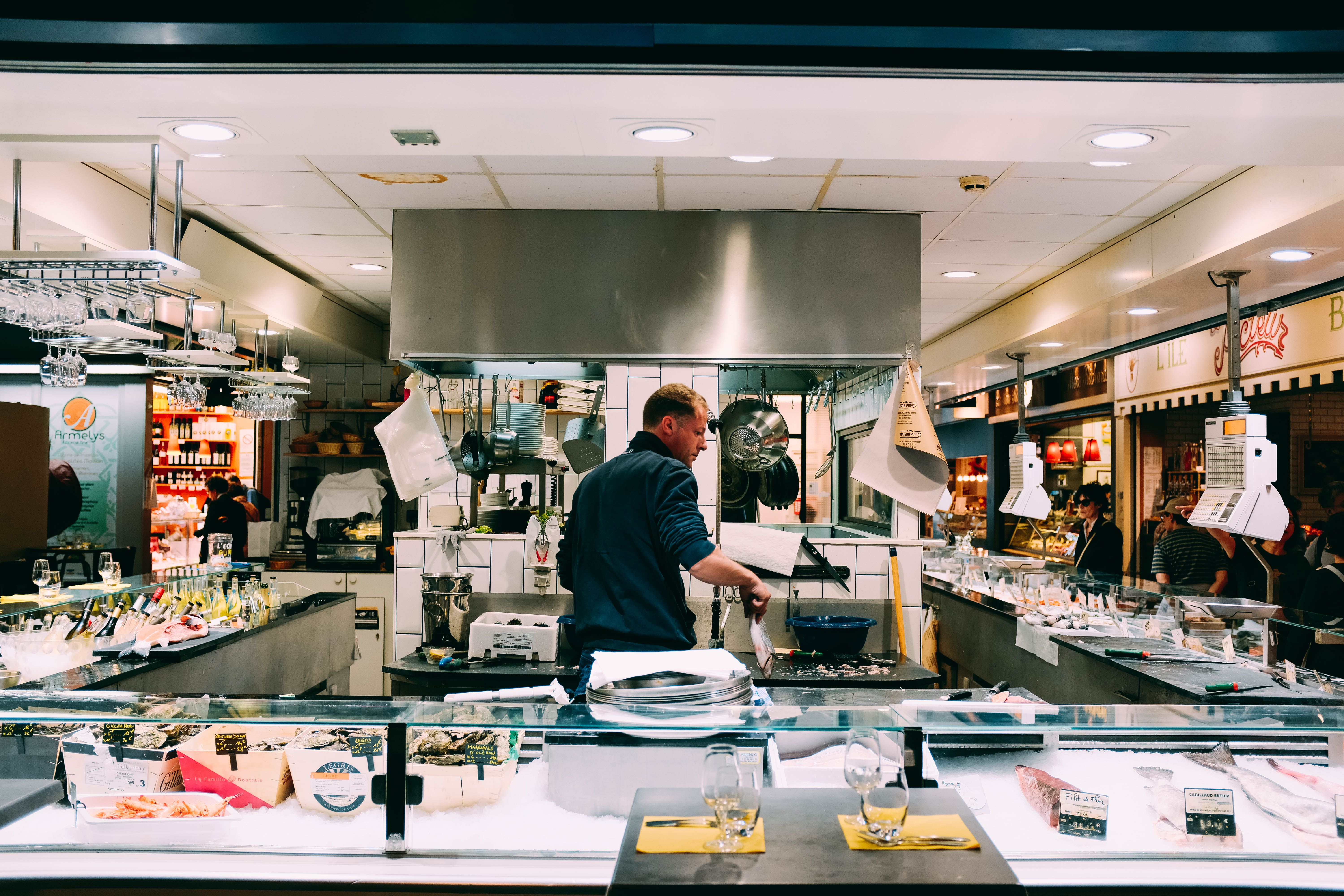 Commercial kitchen technician at work